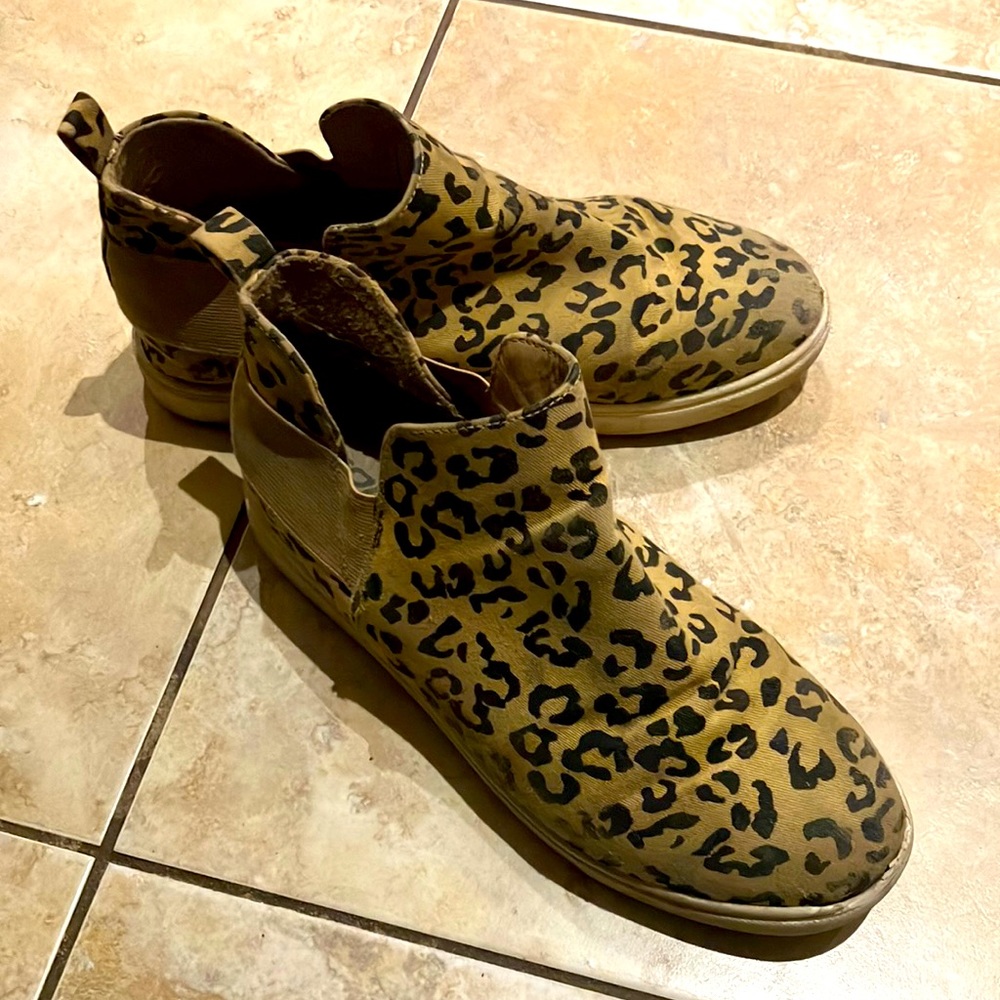 These are brown and black cheetah print boots from SODA